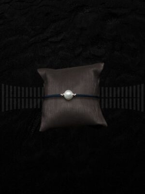 Pulsera acero pavonado con frente oro blanco y perla asturiana